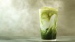 © Vladimir - Iced matcha latte with steam.