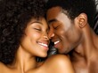 © Azzam - Couple resting in bed, touching foreheads, smiling close up