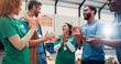 © Jess B/peopleimages.com - Volunteer teamwork, people or happy with applause in community center for outreach success or donation target. NGO charity, social responsibility or group with food bank achievement or campaign goals