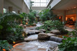 © Shakhnoza - Large indoor waterfall surrounded by lush tropical plants, creating a serene oasis in a bustling city mall. Tourists take photos and children play nearby.