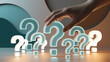 © Inspire Shots Hub - Hand interacting with glowing question marks, some teal, some white, on a curved, neutral background, symbolizing inquiry, choice, decision-making, or problem-solving