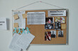 © pressmaster - Noticeboard with empty notepapers, photos of missing people and printed paper documents hanging on wall