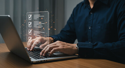 man using laptop with digital checklist interface for online survey and form completion task focus