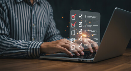 Wall Mural - person completing digital checklist on laptop with red check marks and empty boxes displayed clearly
