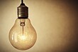 © Harsha - A vintage Edison light bulb hanging, glowing softly against a muted background.
