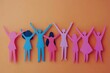 © Imagentive - Paper People Figures Raising Arms in Unity