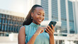 © peopleimages.com - Chat, phone and business with black woman in city for client email, networking app or urban planner. Feedback, building permit news and connection with person outdoor for real estate development