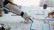 © InfiniteFlow - A futuristic robot arm collaborates with a human hand over business reports on an office desk, showcasing the synergy of technology and human effort in data analysis.Noogenesis