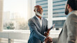 © peopleimages.com - Shaking hands, rooftop and business men with deal in city for finance with risk management contract. Agreement, greet and financial planner with client for investment negotiation with handshake.