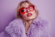 © Ekaterina - Woman in red sunglasses and fur coat poses beside vintage car under city lights, exuding retro glamour and style.