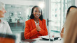 © peopleimages.com - Feedback, interview and smile with business women in boardroom of office for onboarding or recruitment. Answer, discussion and review with human resources team in workplace for hiring process
