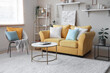 © Pixel-Shot - Stylish living room with yellow sofa, carpet, armchair, carpet and coffee table