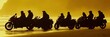 © yeandita - Silhouettes of a group riding motorcycles on a beach at sunset