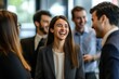 © Surachetsh - Colleagues brainstorm and exchange ideas at a conference, with a smiling business people highlighting the energy of professional collaboration.