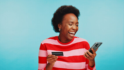 Studio, black woman and excited with mobile for credit card, password or payment success for ecommerce. Mockup, female person or happy with phone for debit details, online shopping or blue background