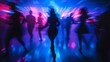 © rajagambar99 - People Dancing in Nightclub with Motion Blur and Bright Neon Lights