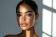 © Arwin - Beautiful woman face in studio light highlighting flawless skin