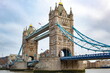 © Jacki - Elaborate architecture of the iconic London Tower Bridge along the Thames River. Photo taken in London United Kingdom during a cloudy day
