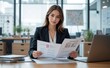 © Jasper - Poised Professional: A poised woman, exuding confidence and expertise, reviews documents, embodying professionalism.