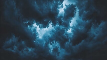 dramatic dark blue stormy cloudscape, moody atmospheric background texture. image ideal for design p