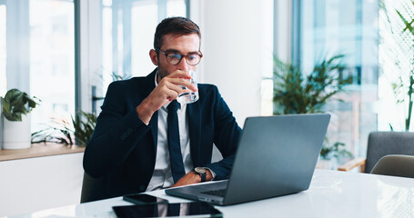 Businessman, water or glass with drink on laptop for hydration, thirst or break at office desk. Man, employee or mineral liquid at computer for natural sustainability, relief or health and wellness