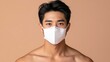 © Chotnarint blue - Man wearing n95 mask in indoor setting protecting against pm2.5 and virus exposure
