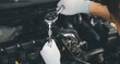 © sorapop - Service outdoor. Close up hands of auto mechanic man working on car engine using wrench to repair and maintenance, broken car care check and fixed the problem and services insurance