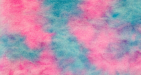 Poster - A colorful background with blue, pink and purple colors. The background is made of fuzzy material. The background is a mix of colors and it gives a sense of fun and playfulness