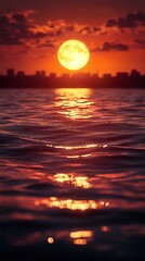 Wall Mural - Stunning Sunset over City Skyline Reflected in Calm Water with Large Full Moon