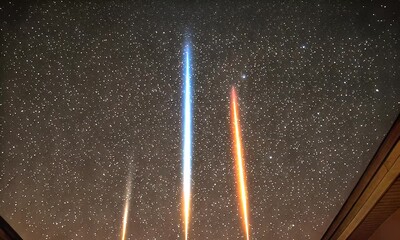 Wall Mural - Colorful Light Streaks Illuminating The Night Sky Filled With Stars Captured In Long Exposure Photography