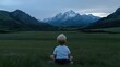 © PT CINTA SEJATI - Child contemplates vast mountain range at twilight