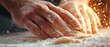 © Jiraphat.N - Dough kneading process by male hands in action kitchen environment food preparation close-up viewpoint culinary art for seo impact
