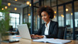 © HaJung - Empowering Young African American Female CEOs: Busy Professional Business Woman Working on Laptop in Office - eLearning and Productivity Concept with Space for Text