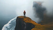 © mur - Solitary figure on coastal clifftop, fog, vastness