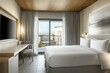 © Ibnu - Modern hotel bedroom with balcony overlooking resort