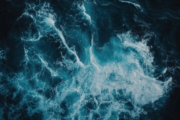 Wall Mural - Powerful ocean waves crashing.  Vast expanse of deep blue water with frothy white crests