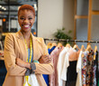© Wavebreak Media - In boutique, fashion designer crossing arms and smiling, showcasing clothing line, copy space