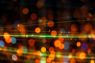 Poster - Abstract image featuring blurred, vibrant orange and green bokeh lights with streaks of light on a dark backdrop, creating a dynamic and energetic glowing effect.