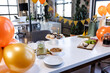 © Wavebreak Media - Celebrating in office with cupcakes, balloons, and snacks on table, festive mood