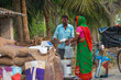 © paltu - A woman collecting ration from the ration distributor