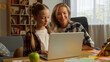 © Yuliia - Glad Caucasian parent mom woman teaching female mother support student daughter girl study online education learner little kid doing homework task remote schoolgirl child using laptop at home family