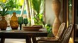 © Alloca Design Studio - a wooden table and chairs in a tropical garden setting