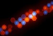 © Aumporn - Abstract black gradient background featuring glowing blue and orange hexagons forming a geometric pattern, digital art, space
