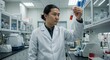 © Pman - A scientist in a crisp white lab coat examining a test tube closely, eyes filled with curiosity, in a bright, modern laboratory