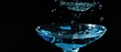 © NIPAPORN - Dramatic close-up of a Blue Hawaii focus on a single droplet falling from the glass