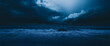 © yuris - Dark stormy ocean waves crashing on shore at night. Background Dramatic clouds. Use Wallpaper