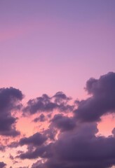 Wall Mural - soft pastel hues paint the twilight sky, clouds glowing gently, purple, calm, pink