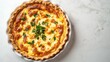© 96 - Delicious Golden Quiche with Fresh Herbs on Marble Background