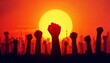 © Сергей Леонид - Silhouetted Raised Fists Against Sunset Symbolizing Unity and Protest
