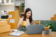 © Nuttapong punna - Startup small business SME, Entrepreneur owner woman using smartphone or tablet taking receive